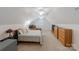Finished room over the garage has carpeted floors, ceiling fans and plenty of storage at 6414 Winding Creek Ln, Denver, NC 28037