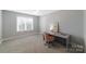 Bedroom with carpeting features natural light, desk space, and modern furniture at 6414 Winding Creek Ln, Denver, NC 28037