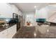 Granite countertops and stainless-steel appliances in kitchen with island overlooking dining area at 6414 Winding Creek Ln, Denver, NC 28037