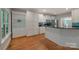 Modern kitchen with white cabinets, hardwood floors, granite countertops and stainless steel appliances at 6414 Winding Creek Ln, Denver, NC 28037