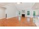 Bright living room boasts hardwood floors, a cozy fireplace, and plenty of natural light at 6414 Winding Creek Ln, Denver, NC 28037