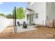Backyard patio with outdoor seating, string lights, and privacy fencing at 6603 Park Meadows Pl, Huntersville, NC 28078