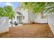 Backyard showing patio and lawn with white privacy fence at 6603 Park Meadows Pl, Huntersville, NC 28078