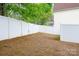 Fenced backyard featuring a mix of open space and wooded areas at 6603 Park Meadows Pl, Huntersville, NC 28078