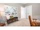 Cozy bedroom featuring neutral tones, a decorative bench, and a large barn-themed wall painting at 6603 Park Meadows Pl, Huntersville, NC 28078