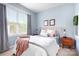 Bright bedroom featuring natural light, a comfortable bed, and a calming color scheme at 6603 Park Meadows Pl, Huntersville, NC 28078