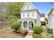 Charming two-story home with a welcoming front porch, manicured landscaping, and a classic architectural design at 6603 Park Meadows Pl, Huntersville, NC 28078