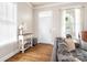 Bright living room featuring hardwood floors, fresh paint, a front door, and plenty of natural light at 6603 Park Meadows Pl, Huntersville, NC 28078