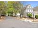 A street view shows a well-maintained two-story home with mature trees and landscaping in a quiet neighborhood at 6603 Park Meadows Pl, Huntersville, NC 28078