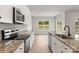Well appointed kitchen with stainless appliances and granite counters at 7015 Jerimoth Dr, Charlotte, NC 28215