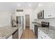 Kitchen features stainless appliances, granite counters, and island at 7015 Jerimoth Dr, Charlotte, NC 28215