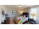 Charming bedroom with a colorful bedspread, window view, and playful decor at 7016 Butternut Oak Ter, Huntersville, NC 28214