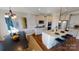 Well-equipped kitchen with granite countertops, stainless steel appliances, an island with barstools, and a dining area at 7016 Butternut Oak Ter, Huntersville, NC 28214