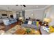 Bright and airy living room with an open view to the kitchen, showcasing modern furnishings and stylish decor at 7016 Butternut Oak Ter, Huntersville, NC 28214