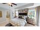 Main bedroom featuring a large window view, elegant furnishings, and a luxurious ambiance at 7016 Butternut Oak Ter, Huntersville, NC 28214