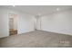 Comfortable carpeted bedroom with a spacious layout and access to closet and hall at 706 Olde England Dr, Lincolnton, NC 28092