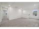 Large bonus room offering neutral carpet and natural light, perfect for entertaining guests at 706 Olde England Dr, Lincolnton, NC 28092