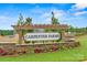 Welcome to Carpenter Farms: Beautiful community entrance with stone accents and colorful landscaping at 706 Olde England Dr, Lincolnton, NC 28092