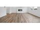 Bright living room featuring wood floors, a modern fireplace, and natural light from large windows at 706 Olde England Dr, Lincolnton, NC 28092