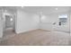 Spacious loft area with carpet flooring, large windows, and ample natural light for versatile use at 706 Olde England Dr, Lincolnton, NC 28092