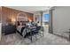 Comfortable bedroom featuring paneled wall accents, a full size desk, and a window view at 711 Olde England Dr, Lincolnton, NC 28092