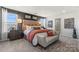Bright main bedroom with dark gray wall accents, a stylish bed, and a window view at 711 Olde England Dr, Lincolnton, NC 28092
