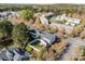 Aerial view of a home with a fenced backyard in a residential neighborhood with mature trees at 7262 April Mist Trl, Huntersville, NC 28078