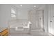 Bathroom features a luxurious soaking tub and a separate glass-enclosed shower at 7262 April Mist Trl, Huntersville, NC 28078