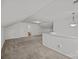 Spacious bonus room with neutral carpet, white walls, and attached bathroom for flexible living at 7262 April Mist Trl, Huntersville, NC 28078