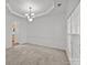Dining room featuring a chandelier, neutral walls and carpet, and bright windows at 7262 April Mist Trl, Huntersville, NC 28078