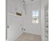 Laundry room featuring built-in shelving and overhead cabinets at 7262 April Mist Trl, Huntersville, NC 28078