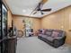Basement with a comfortable seating area and entertainment setup at 7624 Cedarbrook Dr, Charlotte, NC 28215