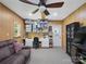 Spacious bonus room with wood paneling, storage, and a ceiling fan for added comfort and functionality at 7624 Cedarbrook Dr, Charlotte, NC 28215