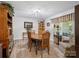 A formal dining area features classic wood furniture, ample lighting, and inviting decor for gatherings at 7624 Cedarbrook Dr, Charlotte, NC 28215