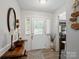 The foyer is bright and welcoming with a decorative door, stylish floors, and elegant decor at 7624 Cedarbrook Dr, Charlotte, NC 28215