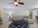 Comfortable living room area with a large sectional sofa and stylish blue rug at 7624 Cedarbrook Dr, Charlotte, NC 28215