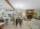 Open concept living space with stone fireplace, and view to back deck provides relaxing space at 7624 Cedarbrook Dr, Charlotte, NC 28215
