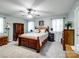 Spacious main bedroom with classic furnishings and natural light at 7624 Cedarbrook Dr, Charlotte, NC 28215