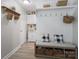 Charming mudroom with built-in bench, storage baskets, and coat hooks at 7624 Cedarbrook Dr, Charlotte, NC 28215