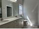Bathroom featuring a double vanity with white countertops and cabinets at 906 Wisteria Way, Salisbury, NC 28146