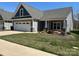 Charming single-story home with a well-manicured lawn, gray siding, and a welcoming entrance at 906 Wisteria Way, Salisbury, NC 28146
