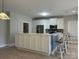 Bright kitchen features white cabinetry, stainless steel appliances, and a large island with seating at 906 Wisteria Way, Salisbury, NC 28146