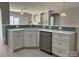 Stylish kitchen boasts white cabinets, stone countertops, and stainless steel appliances for modern cooking at 906 Wisteria Way, Salisbury, NC 28146
