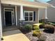 Inviting front porch with stone accents and manicured landscaping enhances the home's curb appeal at 906 Wisteria Way, Salisbury, NC 28146