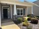 Inviting front porch with stone accents and manicured landscaping enhances the home's curb appeal at 906 Wisteria Way, Salisbury, NC 28146