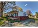 Charming one-story home with a cozy front porch and swing at 100 W 3Rd St, Cherryville, NC 28021