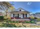 Charming one-story home with a cozy front porch and swing at 100 W 3Rd St, Cherryville, NC 28021
