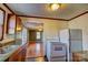 Functional kitchen featuring vintage cabinets and a view into the adjacent living area at 100 W 3Rd St, Cherryville, NC 28021
