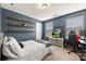 Comfortable bedroom with desk, modern decor, and natural light from a window at 10773 Sapphire Trl, Davidson, NC 28036
