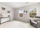 Bright bonus room with comfortable seating, modern decor, and natural light at 10773 Sapphire Trl, Davidson, NC 28036
